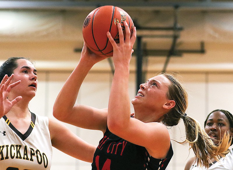 Jefferson City's Kara Daly grabs a rebound during Saturday's Class 6 quarterfinal game against Kickapoo at Fleming Fieldhouse.