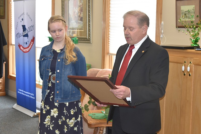 <p>Democrat photo/Paula Tredway</p><p>State Representative Willard Haley reads a resolution that was prepared from the House thanking and congratulating Tipton native Ingrid Keene on her talents. Keene was one of four finalists in Missouri’s Bicentennial Poster Contest.</p>