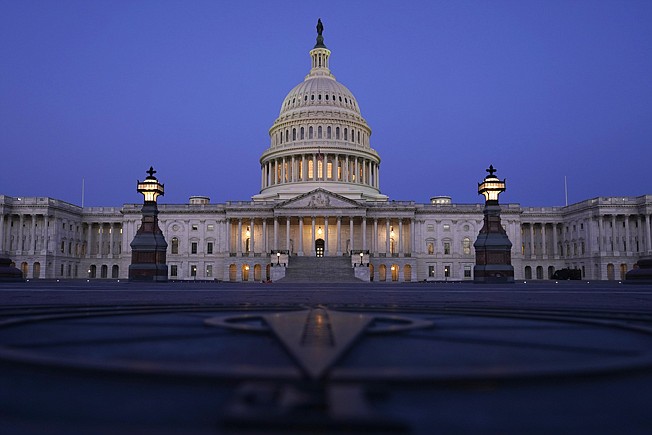 In this March 5, 2021, file photo The Capitol is seen just before sunrise in Washington. The state across the South are the center of the upcoming once-a-decade redistricting battle. The region is the fastest-growing in the country and as a result will be adding an estimated half-a-dozen House seats. (AP Photo/Carolyn Kaster, File)