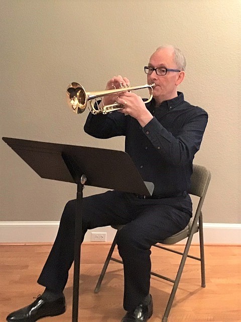 Gregg Finley of Hot Springs, Arkansas, runs through trumpet exercises at his home. More than 40 years ago, Finley stepped away from a career in music to devote more time to matters of faith. "Exchanging a career in music to pursue something of real and lasting value has left me with no regrets," he said. (Public Information Desk of Jehovah's Witnesses)
