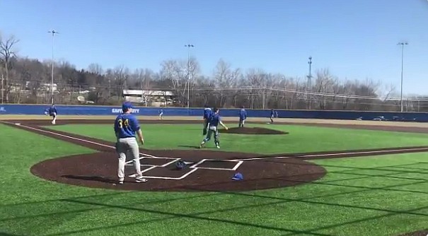 Baseball players warm up Saturday, March 20, 2021, in advance of the Fatima Comets' season opener against the Capital City Cavaliers in Jefferson City.