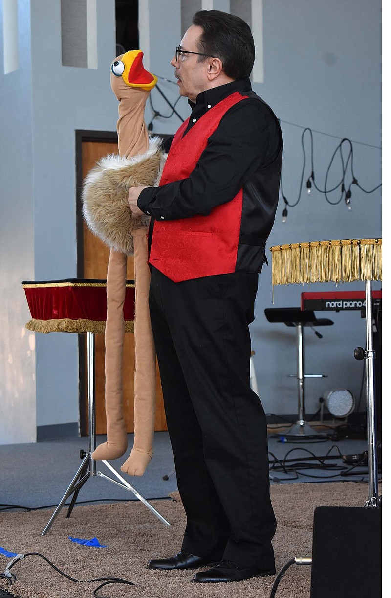 Mike Mann performs puppetry for children at Concord Baptist Church Sunday, March 21, 2021, as part of the church's 50th anniversary celebration. Mann and his wife, Glenda, performed their "Truth and Illusuion Show."