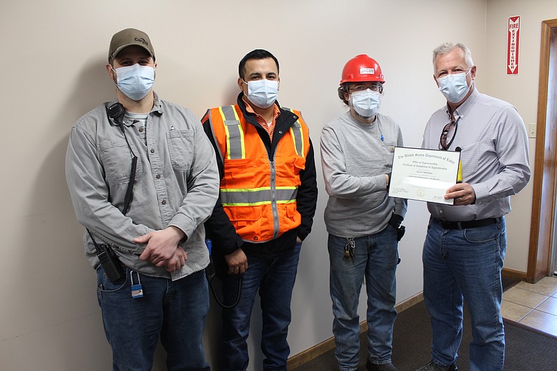 <p>Democrat photo/Austin Hornbostel</p><p>Moniteau County Regional Economic Development president Mike Kelley was on hand at Cargill last week to present Cargill employee Jacob Medrano with an Apprenticeship Program Completion Certificate. Pictured here from left to right are Eric Timmons, Cris Lemus, Medrano and Kelley.</p>