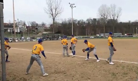 Players warm up in Westphalia on Monday, March 22, 2021, in advance of the baseball contest between Helias and Fatima.