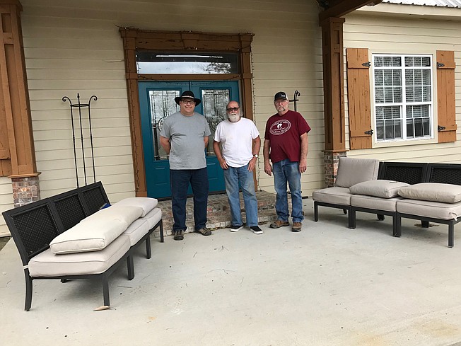 From left, Lancer Legacy Ranch President Matt Fisk, Special Work Skills Teacher Bob Pendley and Runnin WJ Barn Manager Mack Dean stand outside the home where Lancer Legacy Ranch military veterans will get to stay as they help maintain the Runnin WJ Ranch and help the kids with horseback riding. The vintage home dates back to about 1905.