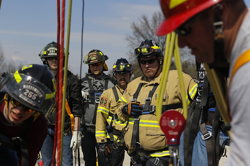 Liv Paggiarino/News Tribune

Trainees watch a simulated rescue taking place during the Basic Grain Engulfment Rescue Training on Saturday in Wardsville. The process was more than a two or three-person job, because there needed to be several people around to lift out those who were stuck in the grain hopper.