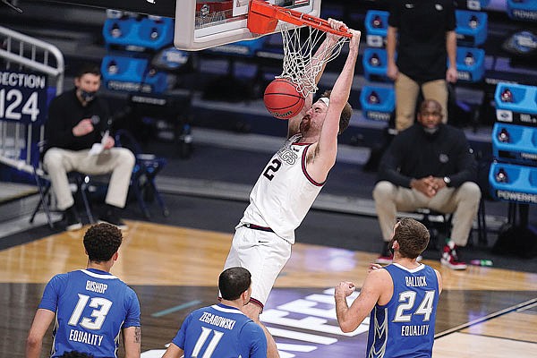 Drew Timme of Gonzaga dunks as Creighton teammates (from left) Christian Bishop, Marcus Zegarowski and Mitch Ballock look on in the second half of Sunday afternoon's Sweet 16 game in the NCAA Tournament at Hinkle Fieldhouse in Indianapolis.