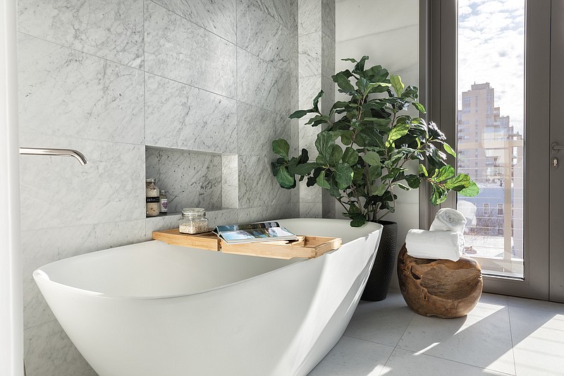 Greenery adds a sense of calm to this master bathroom. (Handout/TNS)