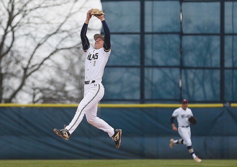 Helias infielder Aleck Barchenski leaps to make a catch during Tuesday's game against Boonville at the American Legion Post 5 Sports Complex.