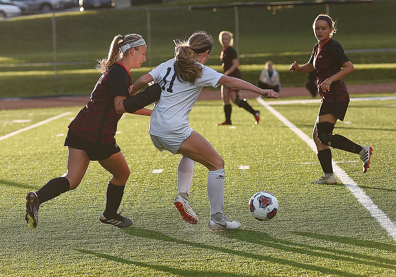 In this 2019 file photo, Daelyn Scheulen of Jefferson City defends Lee's Summit West's Hope Dietrich during a Class 4 sectional game at Dwight T. Reed Stadium.