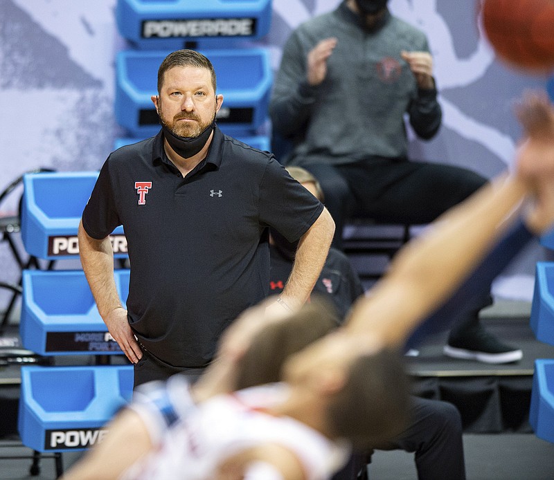 Texas Tech coach Chris Beard watches the action on the court from the sideline during an NCAA Tournament game against Utah State last month in Bloomington, Ind.