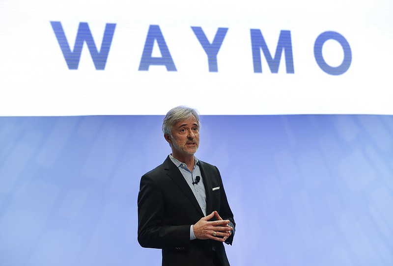 FILE - In this Sunday, Jan. 8, 2017, file photo, John Krafcik, CEO of Waymo, the autonomous vehicle company created by Google's parent company, Alphabet speaks at the North American International Auto Show in Detroit. The executive who steered the transformation of Google’s self-driving car project into a separate company worth billions of dollars is stepping down after more than five years on the job. Krafcik announced his departure as CEO of Waymo, a company spun out from Google, in a Friday, April 2, 2021, blog post that cited his desire to enjoy life as the world emerges from the pandemic. (AP Photo/Paul Sancya, File)
