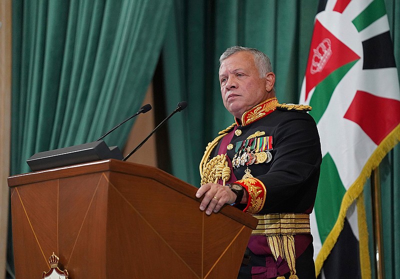In this Dec. 10, 2020  photo released by the Royal Hashemite Court, Jordan's King Abdullah II gives a speech during the inauguration of the 19th Parliament's non-ordinary session, in Amman Jordan.  Jordan's army chief of staff says the half-brother of King Abdullah II was asked to "stop some movements and activities that are being used to target Jordan's security and stability." The army chief of staff denied reports Saturday, April 3, 2021, that Prince Hamzah was arrested. He said an investigation is still ongoing and its results will be made public "in a transparent and clear form."   (Yousef Allan/The Royal Hashemite Court via AP, File)