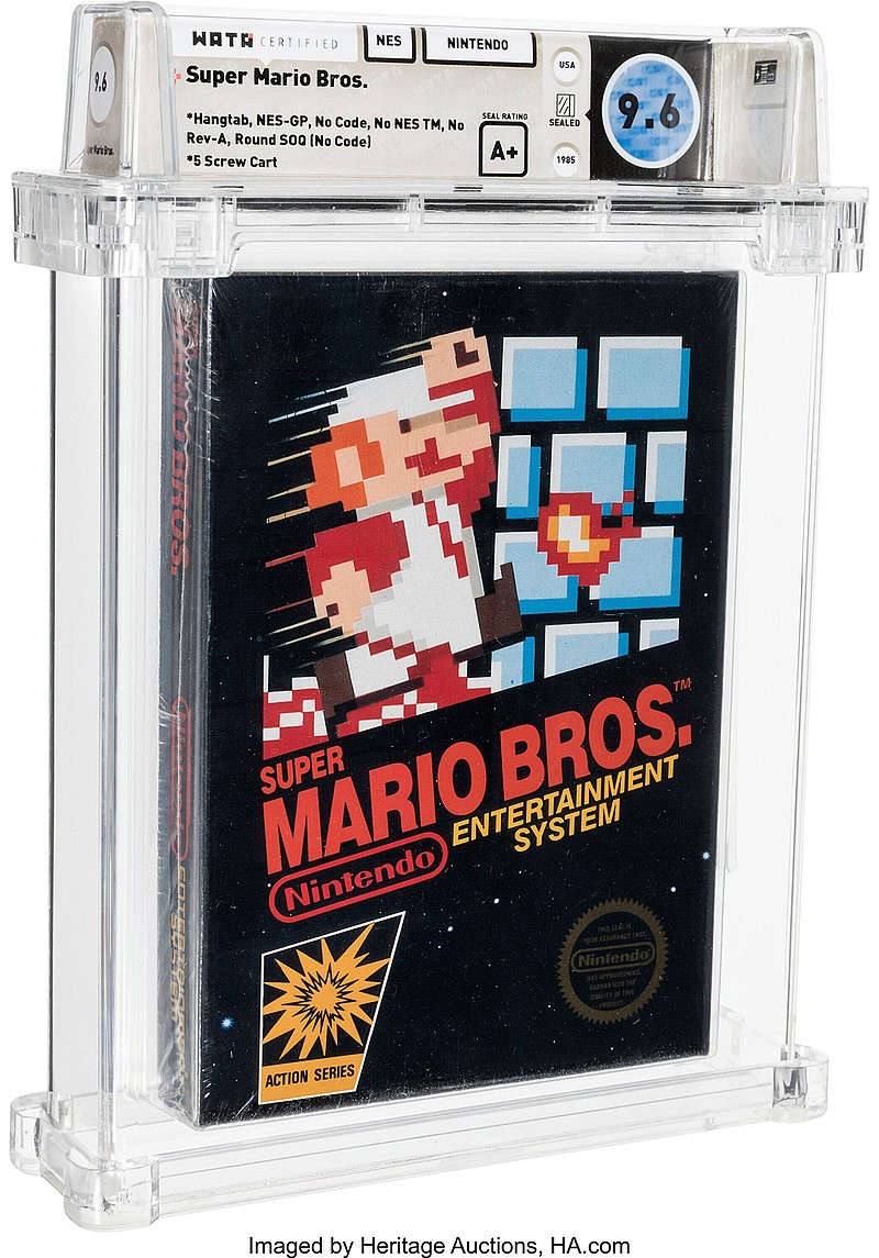 This photo provided by Heritage Auctions, shows an unopened copy of Nintendo's Super Mario Bros., purchased in 1986 and then forgotten about in a desk drawer for decades that has sold for $660,000 at auction. Heritage Auctions in Dallas said the video game sold Friday, April 2, 2021. (Emily Clements/Heritage Auctions via AP)