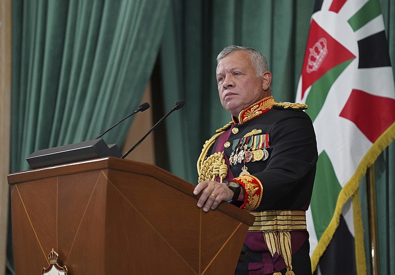 FILE - In this Dec. 10, 2020  photo released by the Royal Hashemite Court, Jordan's King Abdullah II gives a speech during the inauguration of the 19th Parliament's non-ordinary session, in Amman Jordan.  Jordan’s army chief of staff says the half-brother of King Abdullah II was asked to “stop some movements and activities that are being used to target Jordan’s security and stability.” The army chief of staff denied reports Saturday, April 3, 2021, that Prince Hamzah was arrested. He said an investigation is still ongoing and its results will be made public “in a transparent and clear form.”   (Yousef Allan/The Royal Hashemite Court via AP, File)