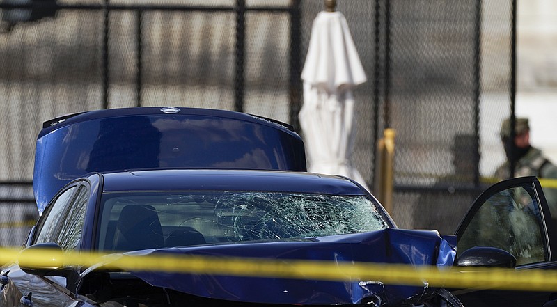 The car that crashed into a barrier on Capitol Hill is seen near the Senate side of the U.S. Capitol in Washington, Friday, April 2, 2021. (AP Photo/Carolyn Kaster)