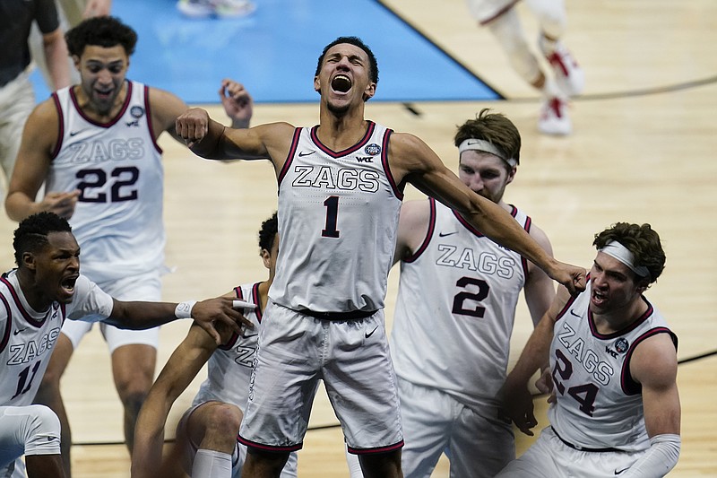 Jalen Suggs of Gonzaga celebrates making the game-winning basket in overtime Saturday night against UCLA in the NCAA Tournament semifinals at Lucas Oil Stadium in Indianapolis.