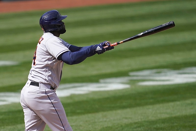 Houston Astros' Yordan Alvarez watches his three-run home run against the Oakland Athletics during the fifth inning of a baseball game in Oakland, Calif., Saturday, April 3, 2021. (AP Photo/Jeff Chiu)