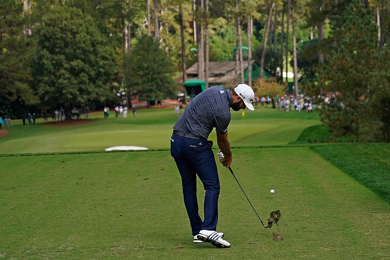 In this Nov. 15, 2020, file photo, Dustin Johnson tees off on the sixth hole during the final round of the Masters golf tournament in Augusta, Ga. Johnson's birdie on this hole was pivotal in winning the Masters last year. (AP Photo/David J. Phillip, File)