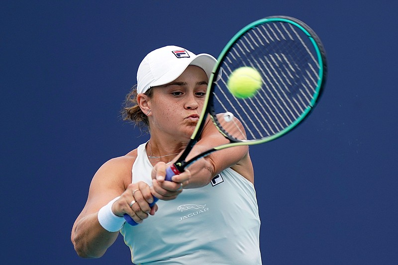 Ashleigh Barty of Australia returns to Bianca Andreescu of Canada during the finals at the Miami Open tennis tournament, Saturday, April 3, 2021, in Miami Gardens, Fla. Barty won 6-3, 4-0, as Andreescu retired due to injury. (AP Photo/Lynne Sladky)