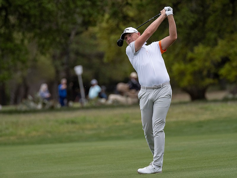 Matt Wallace hits his second shot on the second hole during the third round of the Valero Texas Open golf tournament in San Antonio, Saturday, April 3, 2021. (AP Photo/Michael Thomas)