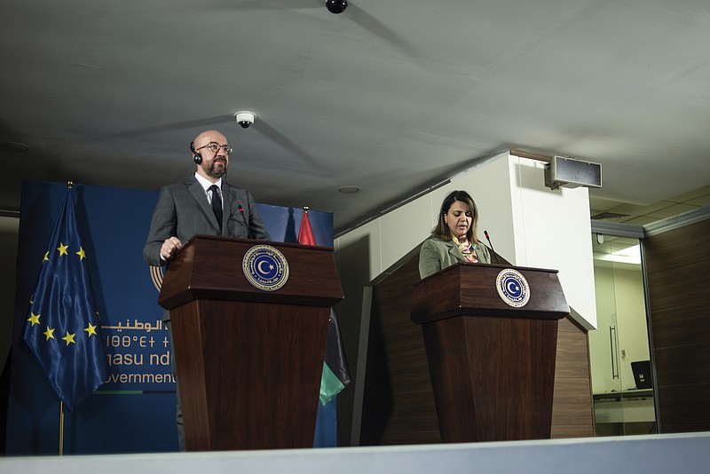 Najla Al-Manqoush, the Minister of Foreign Affairs, gives a press statement together with Mr. Charles Michel, the President of the European Council over the agreement of the European Union's support of peace and stability for Libya at the Prime Minister's office on Sunday, April 4, 2021, in Tripoli, Libya. (AP Photo/Nada Harib)