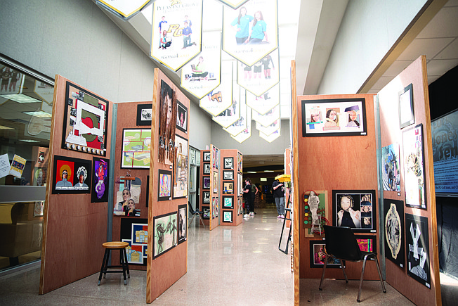 Works of art are pictured at the entrance of Pleasant Grove High School's Juried Art Exhibition, which took place Monday evening and featured more than 500 works created by PGHS art program students.