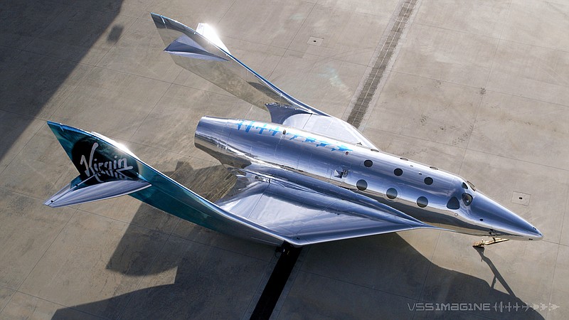 In this undated photo provided by Virgin Galactic is the VSS Imagine, the first SpaceShip III in the Virgin Galactic Fleet in Mojave, Calif. Virgin Galactic rolled out its newest spaceship Tuesday, March 30, 2021, as the company looks to resume test flights in the coming months at its headquarters in the New Mexico desert. Company officials said it will likely be summer before the ship undergoes glide flight testing at Spaceport America in southern New Mexico. (Virgin Galactic via AP).