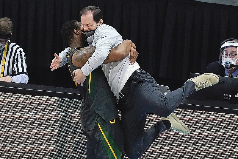 Baylor coach Scott Drew gets a hug from guard Mark Vital at the end of Monday night's  win against Gonzaga in the title game of the NCAA Tournament at Lucas Oil Stadium in Indianapolis. Baylor won 86-70.