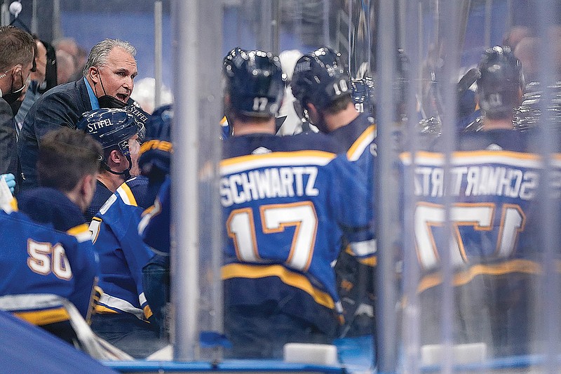 Blues coach Craig Berube talks with his team during the second period of Monday night's game against the Golden Knights in St. Louis.