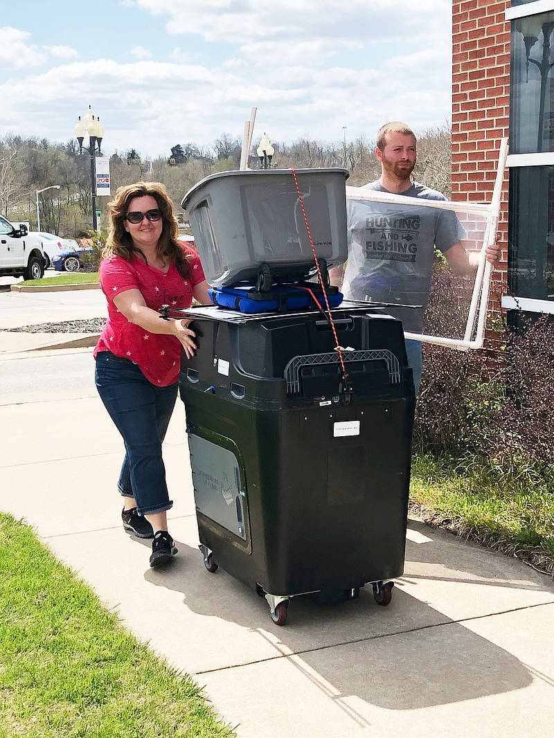 Callaway County Clerk Ronda Miller and county maintenance worker Michael Barnes deliver a voting machine to Fulton City Hall on Monday afternoon. Polls open at 6 a.m. for today's general election — which features 15 races, some unopposed, in Callaway County — and close at 7 p.m.