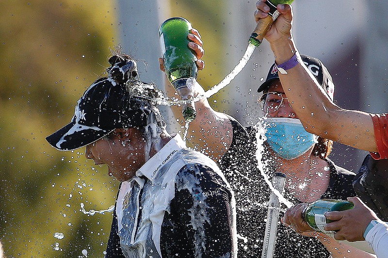 Patty Tavatanakit is sprayed with bottles of champagne Sunday after winning the LPGA's ANA Inspiration at Mission Hills Country Club in Rancho Mirage, Calif.