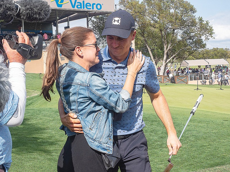 Jordan Spieth gives his wife, Annie Verret, a hug Sunday after winning the Valero Texas Open in San Antonio.