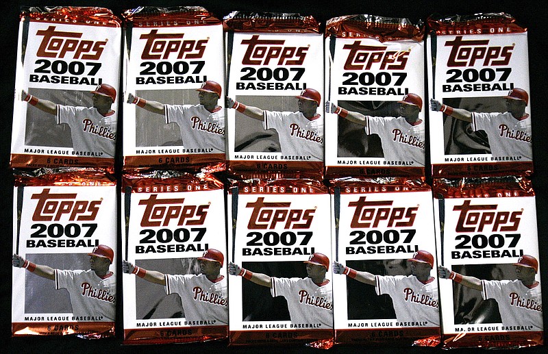 FILE - In this March 6, 2007 file photo, Topps baseball cards are seen in Boston.   Sports trading card company Topps is combining with a special purposes acquisition company in a deal valued at $1.3 billion and seeking a public listing. Topps Co. said Tuesday, April 6, 2021,  that it will join with Mudrick Capital Acquisition Corp., which will make a $250 million investment.   (AP Photo/Chitose Suzuki, file)