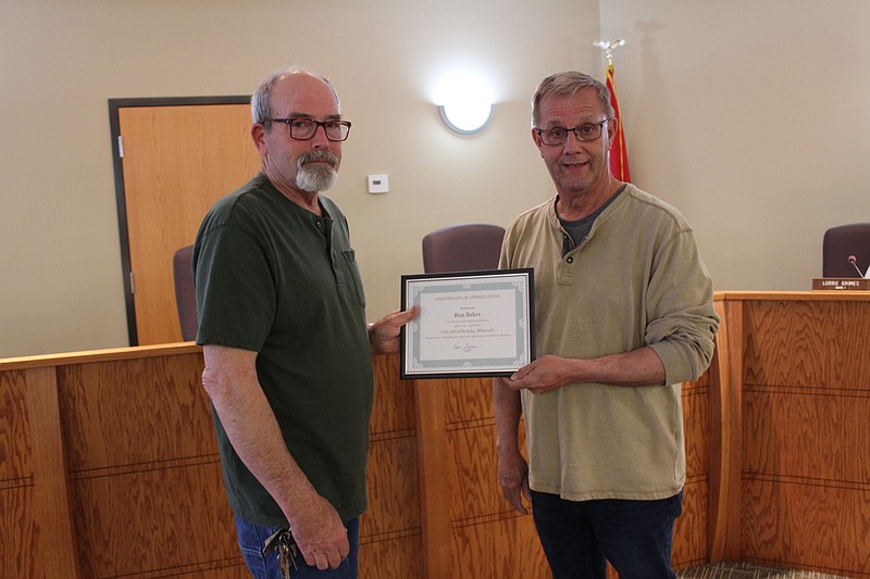 <p>Democrat photo/Austin Hornbostel</p><p>Outgoing California mayor Norris Gerhart presents outgoing Ward 1 Alderman Ron Baker with a certificate of appreciation for his six years of service on the board of aldermen.</p>