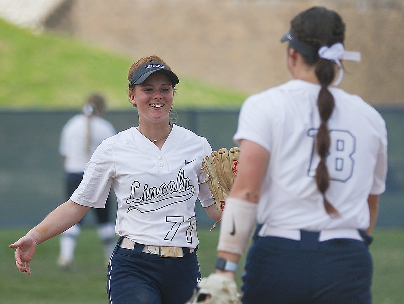Lincoln second baseman Leslie Callahan congratulates first baseman Kendra Holt on a successful putout during the first game in Tuesday's doubleheader against Missouri S&T at LU Softball Field.