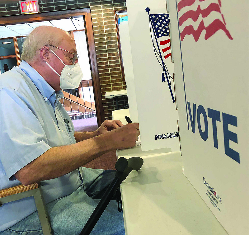 David McDaniel fills out his ballot during Tuesday's municipal election at the Fulton Ward 4 polling location at First Baptist Church at 701 Court St. The election featured 15 races in Callaway County — some unopposed — that focused on both city government and school boards.