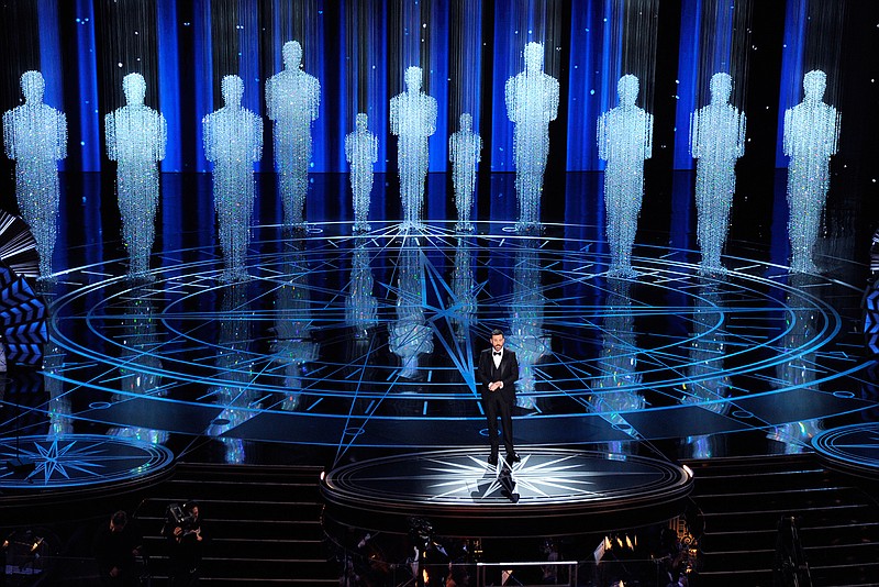 In this Feb. 26, 2017 file photo, host Jimmy Kimmel speaks at the Oscars in Los Angeles. Some people watch awards shows out of love, others because they love to hate. But this year, as ratings have taken a dive, will anybody tune in to the Oscars? Pushed by the pandemic from its usual berth of February or early March, the Academy Awards will be presented April 25 on ABC.  (Photo by Chris Pizzello/Invision/AP, File)