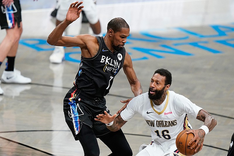Brooklyn Nets' Kevin Durant (7) defends against New Orleans Pelicans' James Johnson (16) during the second half of an NBA basketball game Wednesday, April 7, 2021, in New York. (AP Photo/Frank Franklin II)