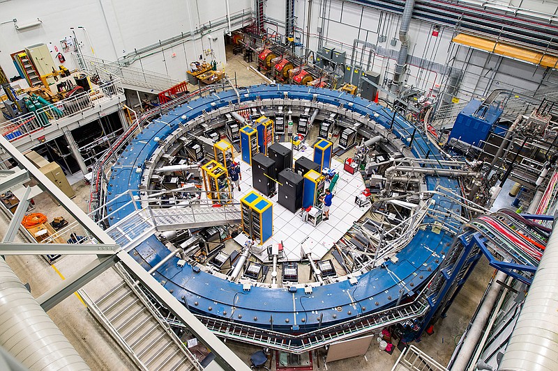 This August 2017 photo made available by Fermilab shows the Muon g-2 ring at the Fermi National Accelerator Laboratory outside of Chicago. It operates at -450 degrees Fahrenheit (-267 degrees Celsius) to detect the wobble of muons as they travel through a magnetic field. Preliminary results published in 2021 of experiments from here and the CERN facility in Europe challenge the way physicists think the universe works, a prospect that has the field of particle physics both baffled and thrilled. (Reidar Hahn/Fermilab via AP)