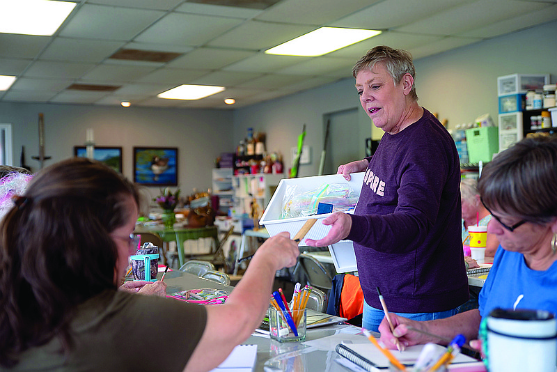 Nancy Hall Cole, teacher and owner at Art Play — A Learning Studio, passes out rulers to her class Wednesday in Atlanta, Texas. She holds classes Mondays through Wednesdays, with more planned in the future.