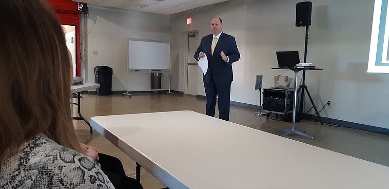  James Henry Russell, vice president and CFO at Truman Arnold Companies, addresses a crowd for Coffee and Conversation, a new series from Leadership Texarkana. 