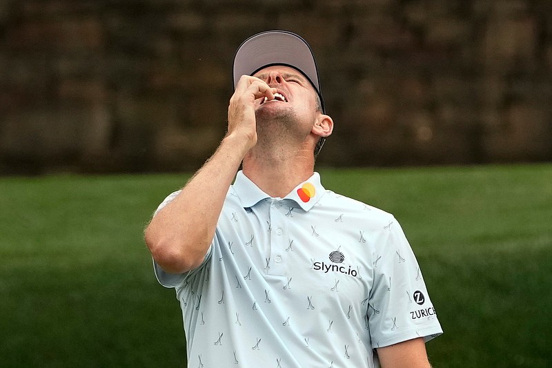 Justin Rose, of England, reacts to missing a birdie putt on the 11th hole during the first round of the Masters golf tournament on Thursday, April 8, 2021, in Augusta, Ga. (AP Photo/David J. Phillip)