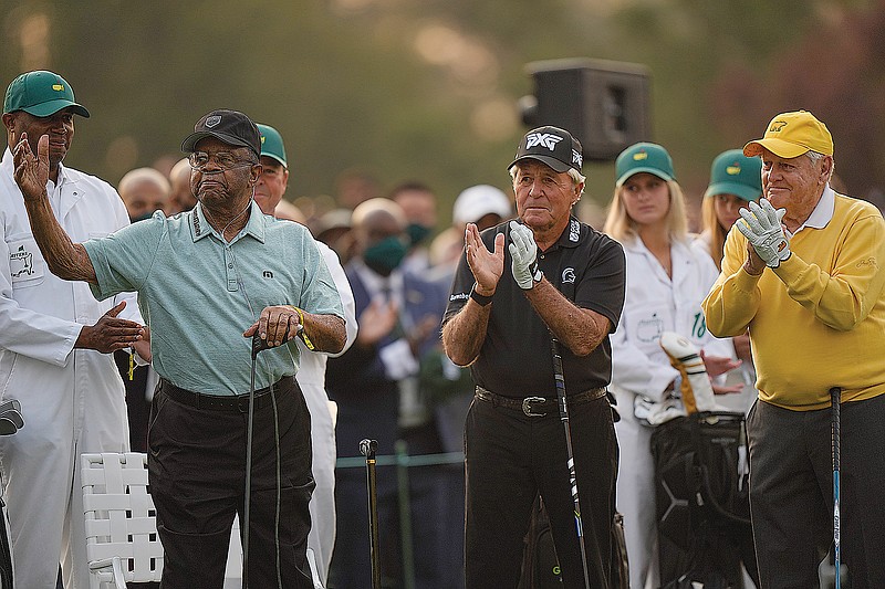 Gary Player (center) and Jack Nicklaus applaud as Lee Elder waves before the ceremonial first tee shot Thursday at the Masters in Augusta, Ga.