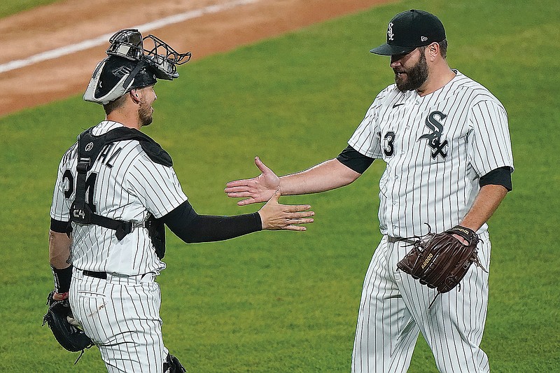 White Sox starting pitcher Lance Lynn celebrates with catcher Yasmani Grandal after Lynn went the distance on the mound in Thursday's 6-0 victory against the Royals in Chicago.