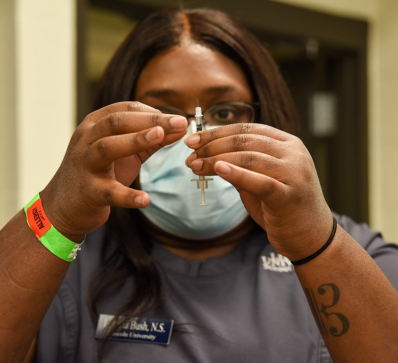 Julie Smith/News Tribune
Latricia Bush measures medication for a dose to be administered during Thursday's class at Lincoln University School of Nursing.