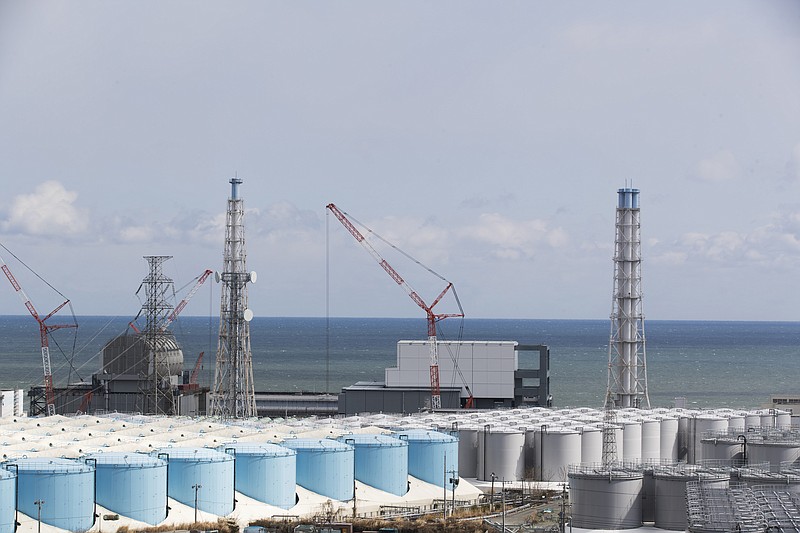 FILE - In this Feb. 27, 2021, file photo, the Pacific Ocean looks over nuclear reactor units of No. 3, left, and 4 at the Fukushima Daiichi nuclear power plant in Okuma town, Fukushima prefecture, northeastern Japan. The Japanese government has decided to get rid of the massive amounts of treated but still radioactive water stored in tanks at the wrecked Fukushima nuclear plant by releasing it into the Pacific ocean, a conclusion widely expected but delayed for years amid protests and safety concerns. Prime Minister Yoshihide Suga on Wednesday, April 7, 2021, told top fisheries association officials that his government believes the release to sea is the most realistic option and a final decision will be made “with days.”(AP Photo/Hiro Komae, File)