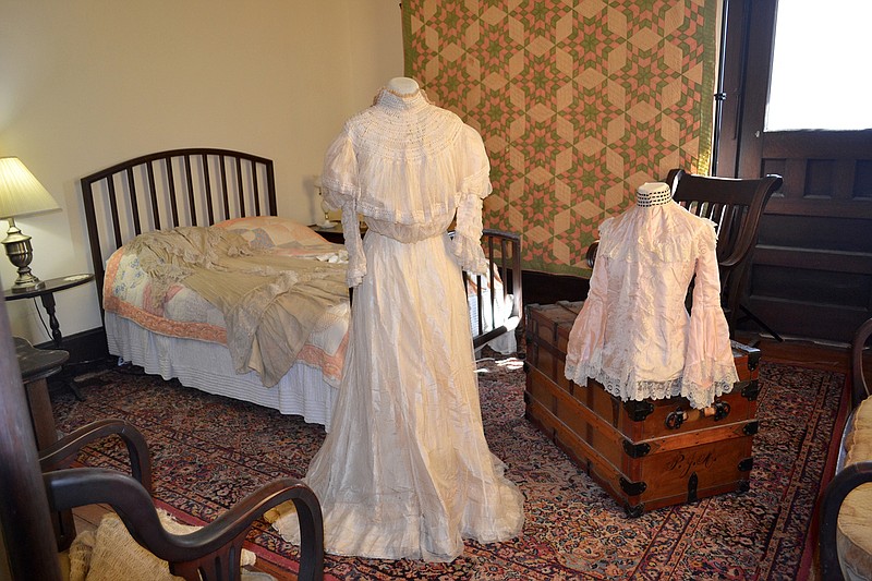 Mary Ahern's wedding dress on display in her room, just off the master bedroom. (PHOTO BY KATE STOW)