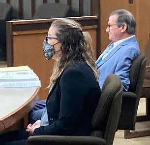 Former Texarkana Independent School District teacher's aide Ashlyn Bell, accused of sexual misconduct with three male students, appears Friday with her lawyer, Bruce Condit of Texarkana, for a pretrial hearing at the Bowie County Courthouse in New Boston, Texas. Jury selection in the case is scheduled for later this month.