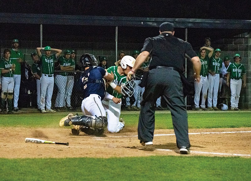 Helias catcher Ethan Holzhauser and Blair Oaks' Ian Nolph collide at the plate during Friday night's game in the Jays Baseball Classic at the American Legion Post 5 Sports Complex.